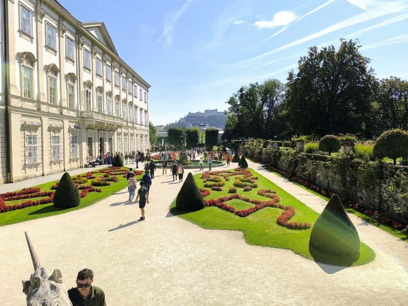 From Vienna: Scenic Hallstatt & Historic Salzburg Day Tour - Salzburg Old Town walk: Mozart, Mirabell Gardens, and getting oriented fast