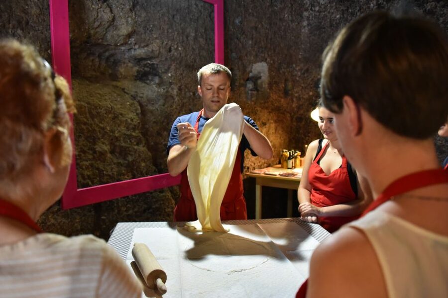 Salzburg: Apple Strudel & Salzburger Nockerl Class - Getting to Ursulinenplatz and walking into that cave-like kitchen