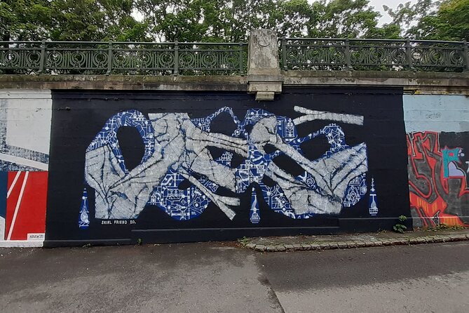 Street Art Tour in Vienna - Friedensbrücke: TS90 crew pieces and Manuel Muriel’s octopus
