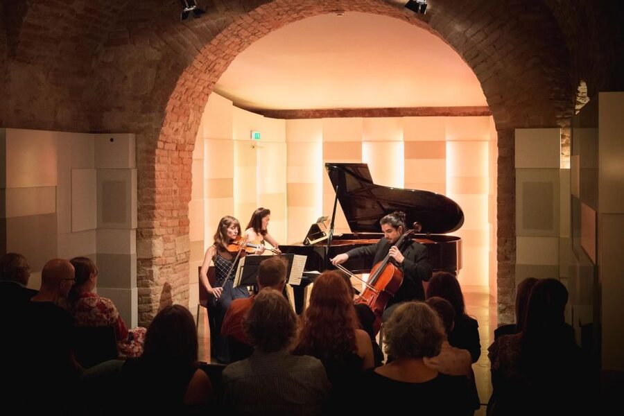 Vienna: Classical Concert at Mozarthaus with Museum Entry - Entering the concert cellar: candlelight, close sound, and the Wiener Ensemble